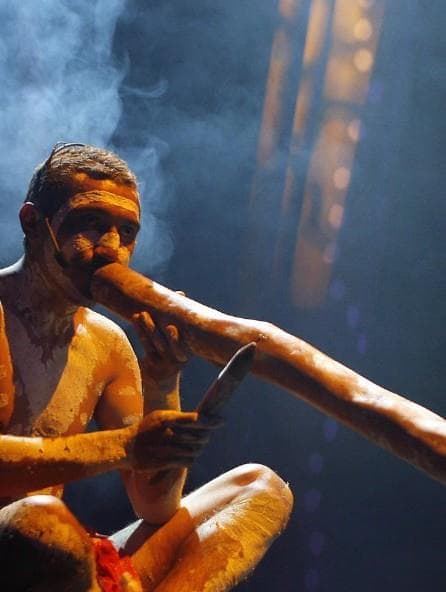 Aboriginal man playing the didgeridoo